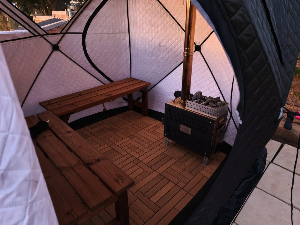 TwigGo portable sauna tent in an outdoor setting